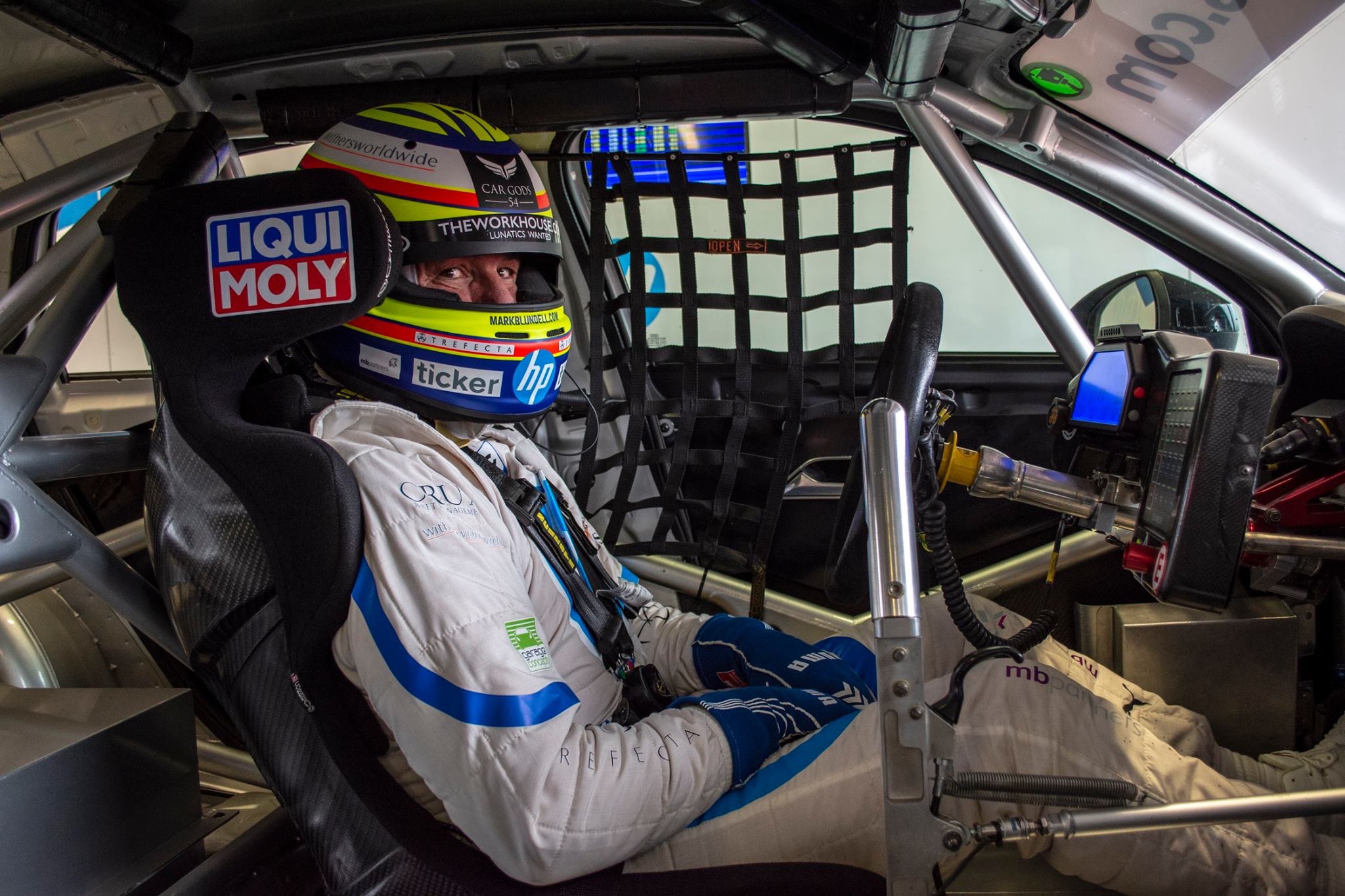 Mark Blundell in a AmD Tuning Audi S3 for the British Touring Car Championship, sponsored by Ticker