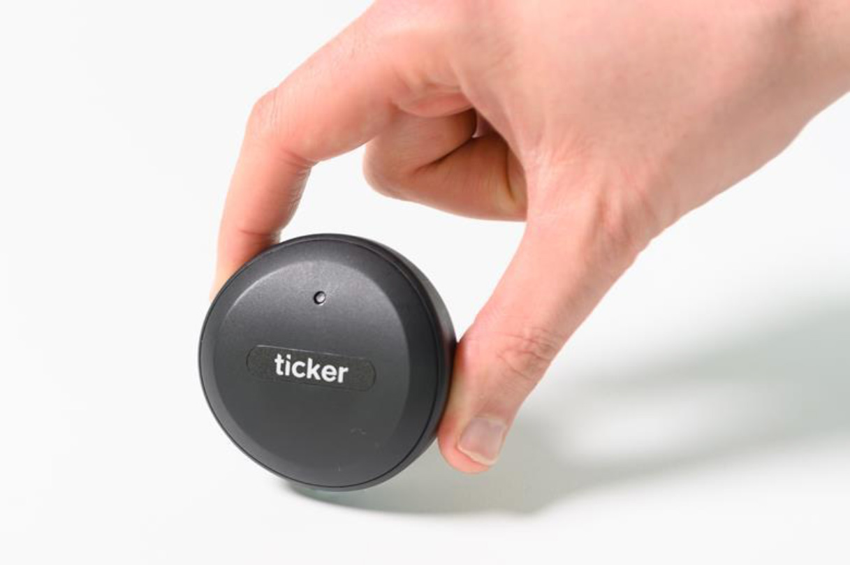 The Ticker box in a person's hand