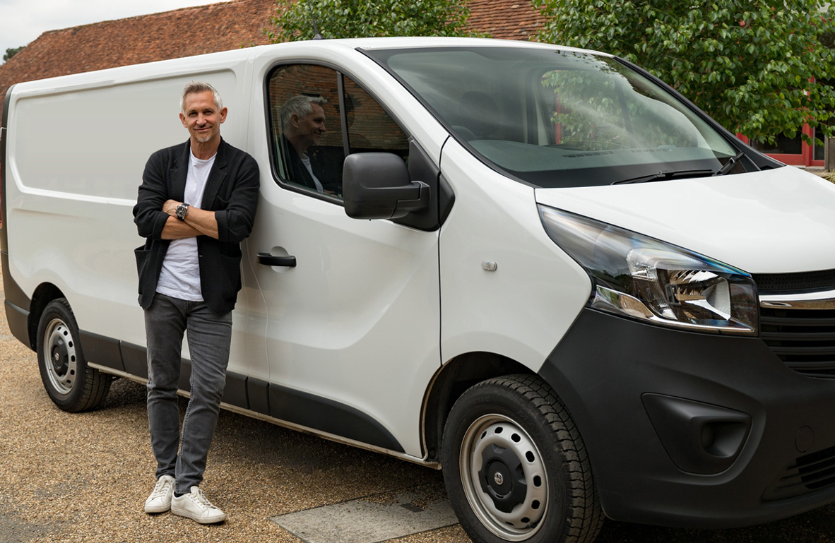 Gary Lineker in the back of a van holding the Ticker box