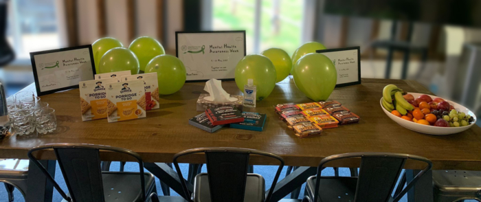 Table with snacks, balloons and mental health advice